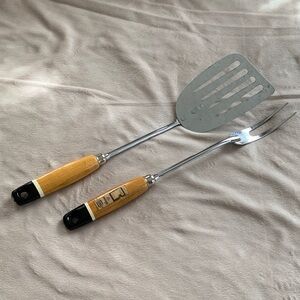 Ekco chrome spatula and meat fork set. 
Chrome-plated metal with wood handles